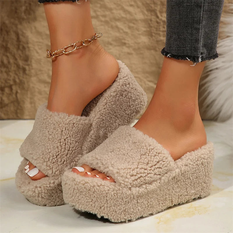 Women's beige fuzzy platform wedge slippers with open toe design — front angled view