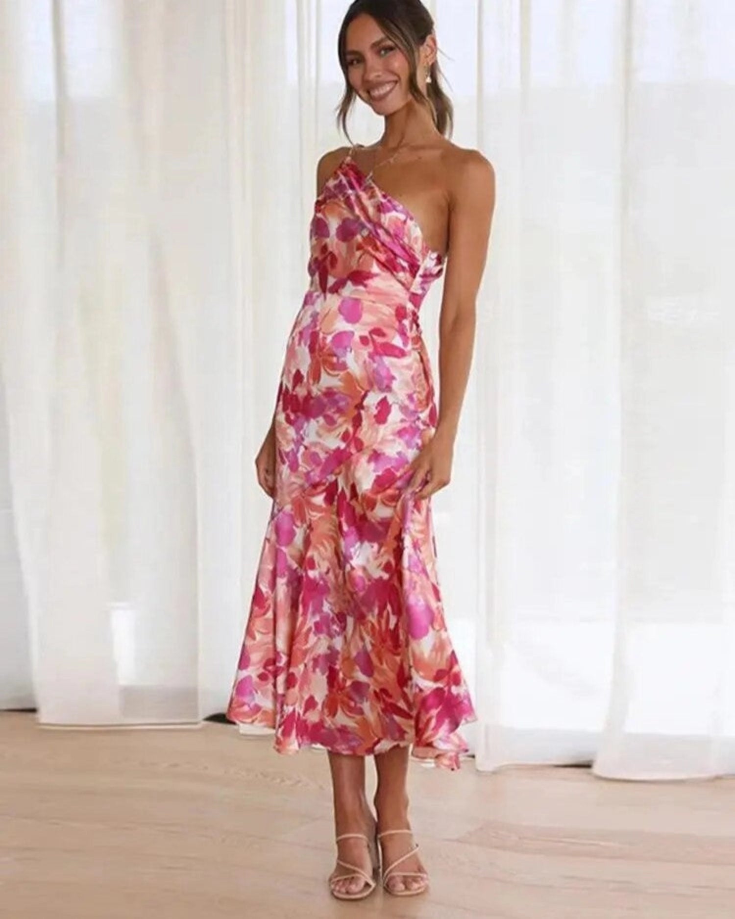 Pink floral asymmetric one-shoulder midi dress with ruffled hem — front view