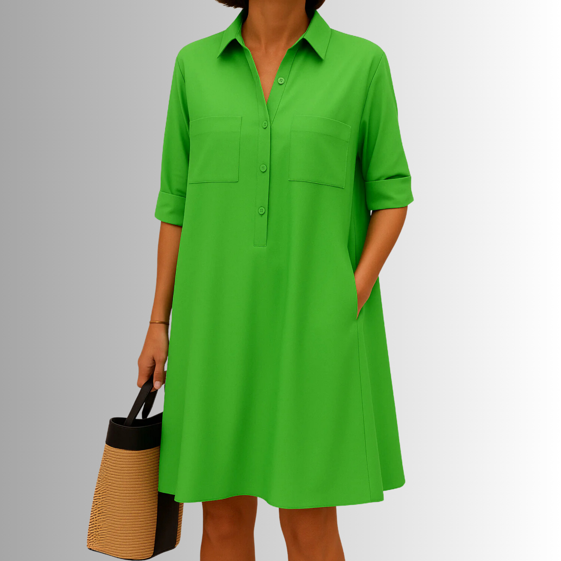 Green A-line shirt dress with chest pockets and short sleeves — front view