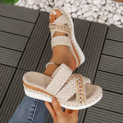Beige woven slip-on sandals with embellished straps and platform sole — angled side view