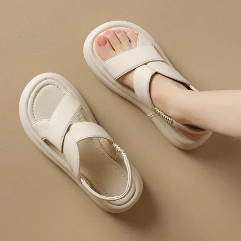 Women's beige orthopedic wedge sandals with crossover straps and elastic slingback — overhead view