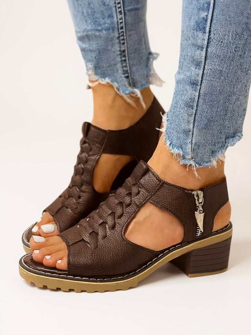 Brown braided leather zip-up block heel sandals with lug sole — side view on model wearing jeans