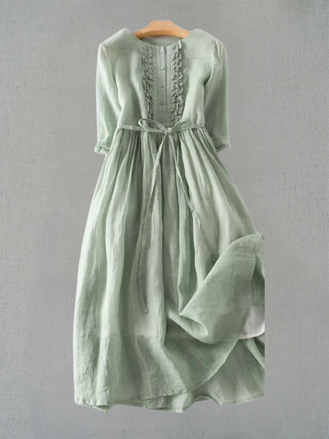 Sage green linen midi dress with ruffle front detail and tie waist — front view