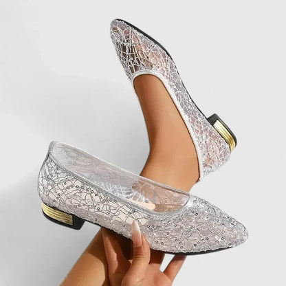 Silver lace pointed toe flats with low gold block heel and crystal embellishments — angled side view on model