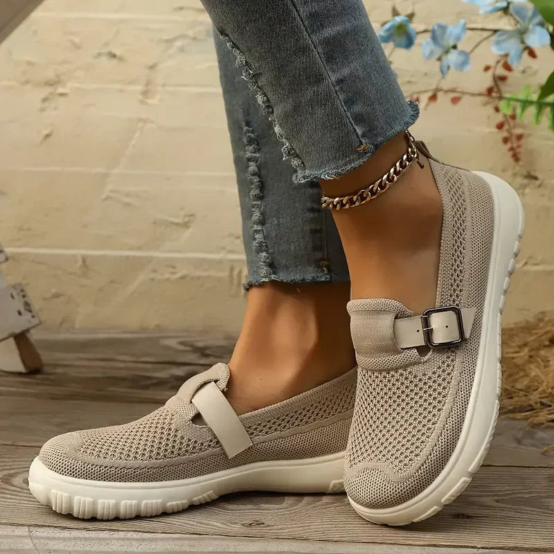 Beige mesh Mary Jane sneakers with buckle strap and white sole — side view on foot