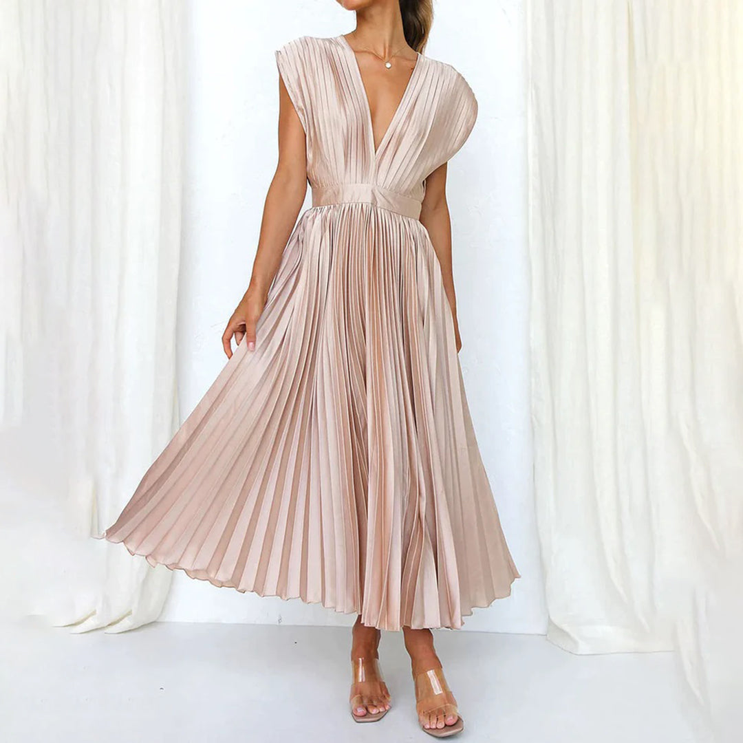 Pleated blush pink midi dress with deep V-neck and cap sleeves — front view