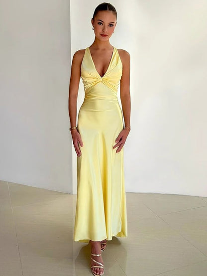 Women's yellow v-neck maxi dress with twisted waist detail — front view