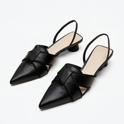Black pointed-toe slingback sandals with woven leather detail — elevated three-quarter view