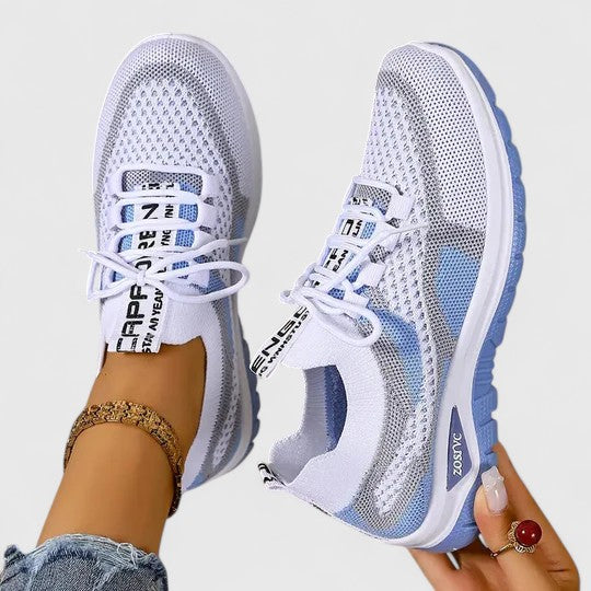 Women's white and blue mesh lace-up sneakers with breathable upper — angled side view