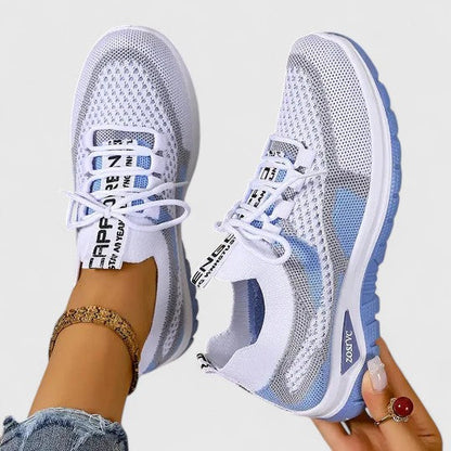 Women's white and blue mesh lace-up sneakers with breathable upper — angled side view