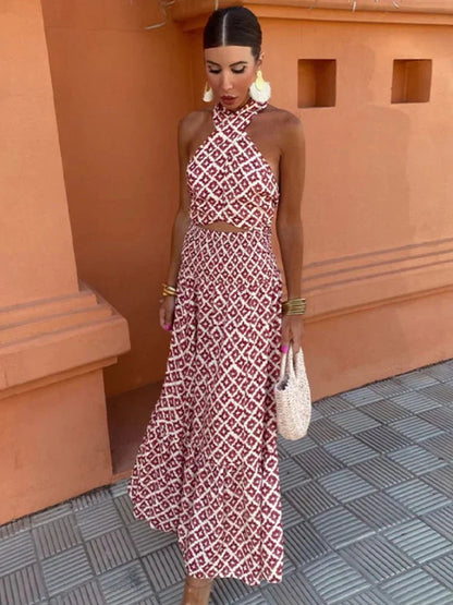 Women's halter neck maxi dress with red geometric print — front view
