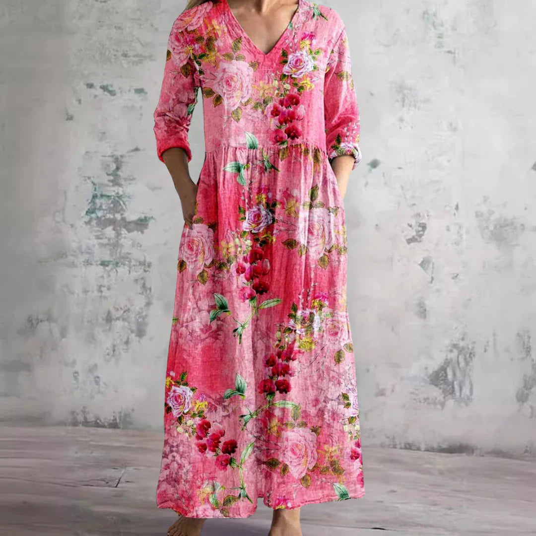 Pink floral maxi dress with V-neck and three-quarter sleeves — front view