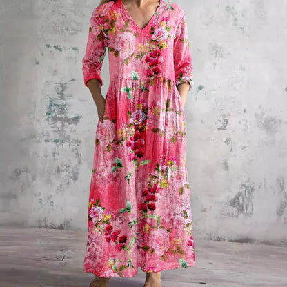Pink floral maxi dress with V-neck and three-quarter sleeves — front view