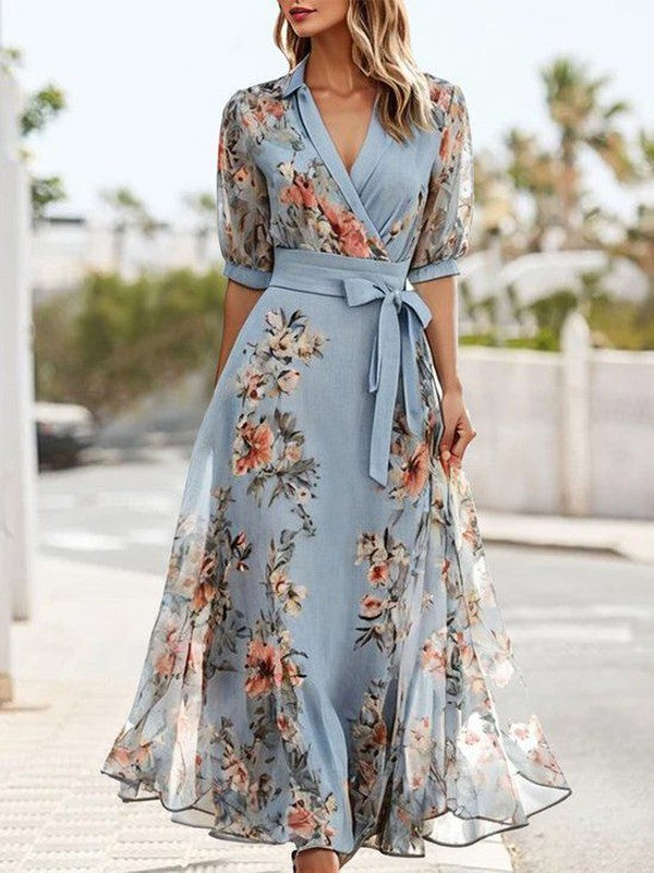 Women's light blue floral midi wrap dress with sheer sleeves and tie waist — front view