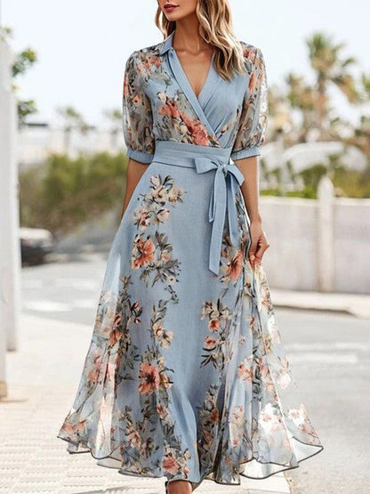 Women's light blue floral midi wrap dress with sheer sleeves and tie waist — front view