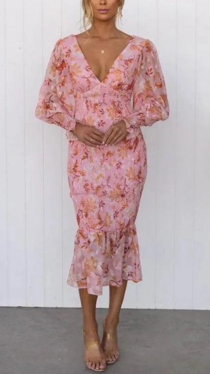 Pink floral midi dress with puff sleeves and ruffle hem — front view