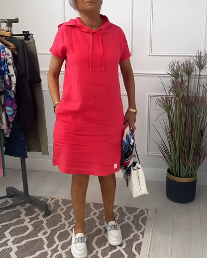 Pink hooded midi dress with short sleeves and front pocket — full-length front view
