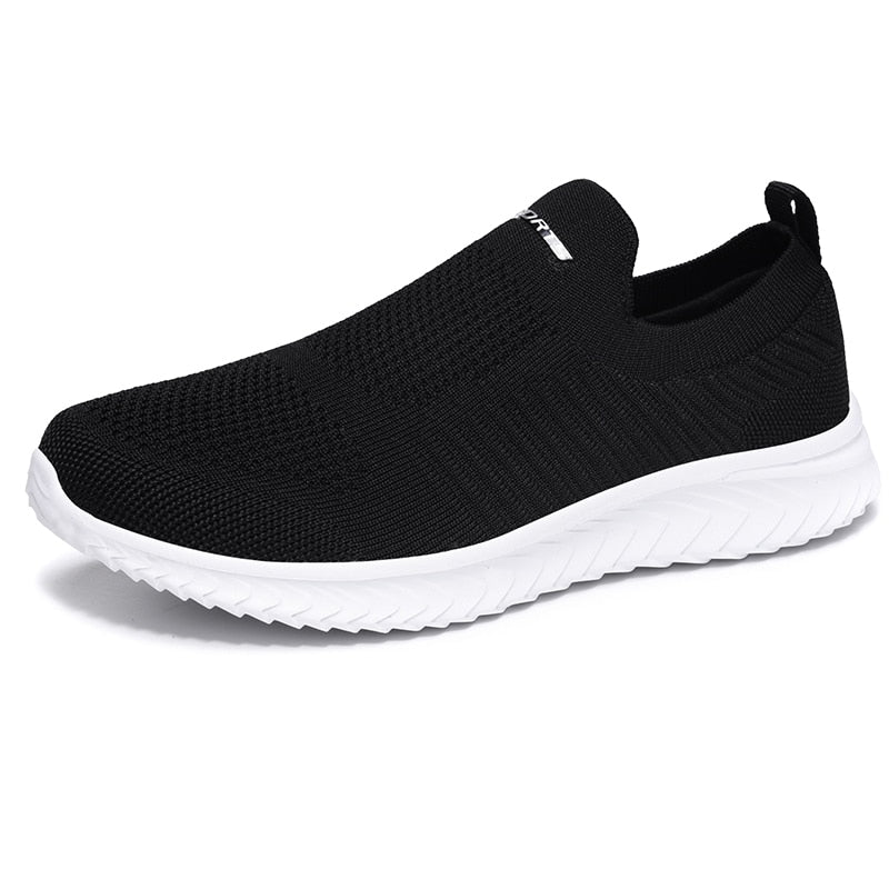 Black knit slip-on walking shoe with white sole — side view
