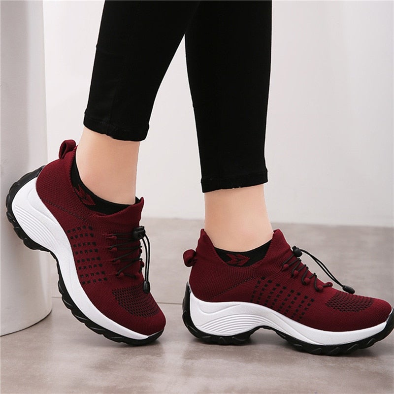 Women's burgundy orthopedic sneakers with knit upper and platform sole — side angle view