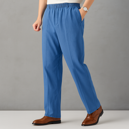 Blue linen drawstring pants with elastic waist and side pockets — front three-quarter view