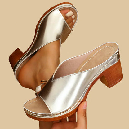 Silver metallic open-toe platform sandals with wooden block heels — angled side view