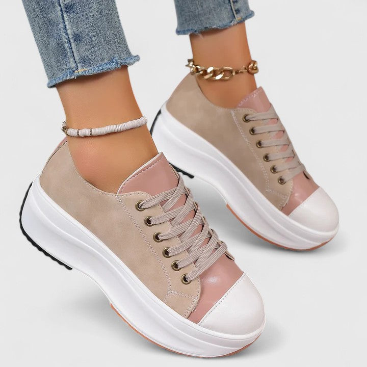 Women's beige and pink platform sneakers with white soles and lace-up design — front angle view