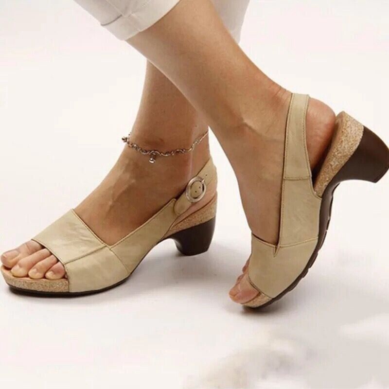Women's beige block heel slingback sandals with ankle buckle strap — side view on model
