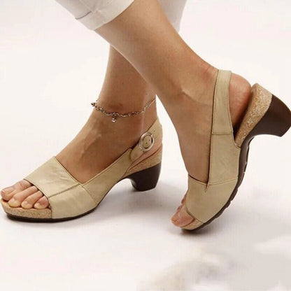 Women's beige block heel slingback sandals with ankle buckle strap — side view on model