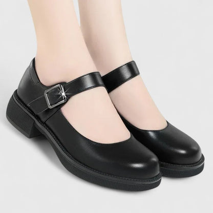 Black leather Mary Jane orthopedic shoes with ankle strap and buckle — side angle view