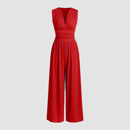 Red sleeveless V-neck jumpsuit with ruched waist and wide-leg pants — front view