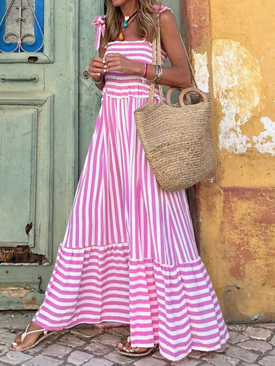 Pink and white striped maxi dress with ruffled tiers and shoulder ties — front view
