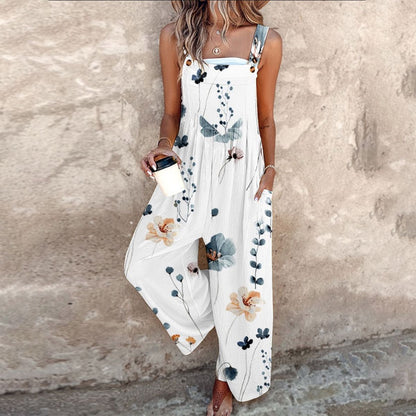 Women's white floral print wide-leg jumpsuit with adjustable straps and button details — front view