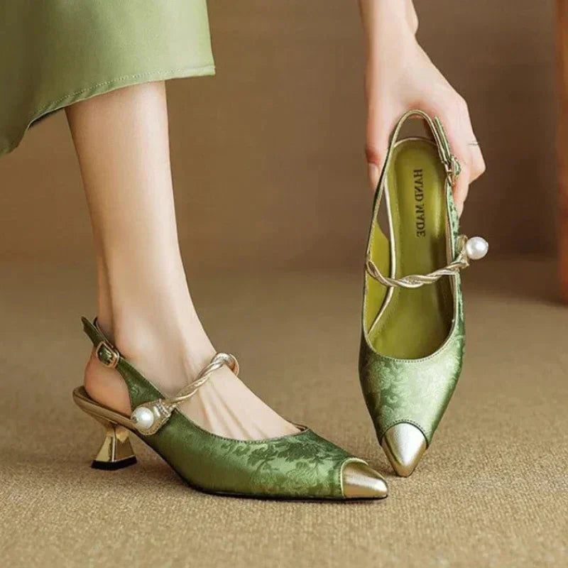 Green satin pointed toe slingback pumps with pearl ankle strap detail — side view