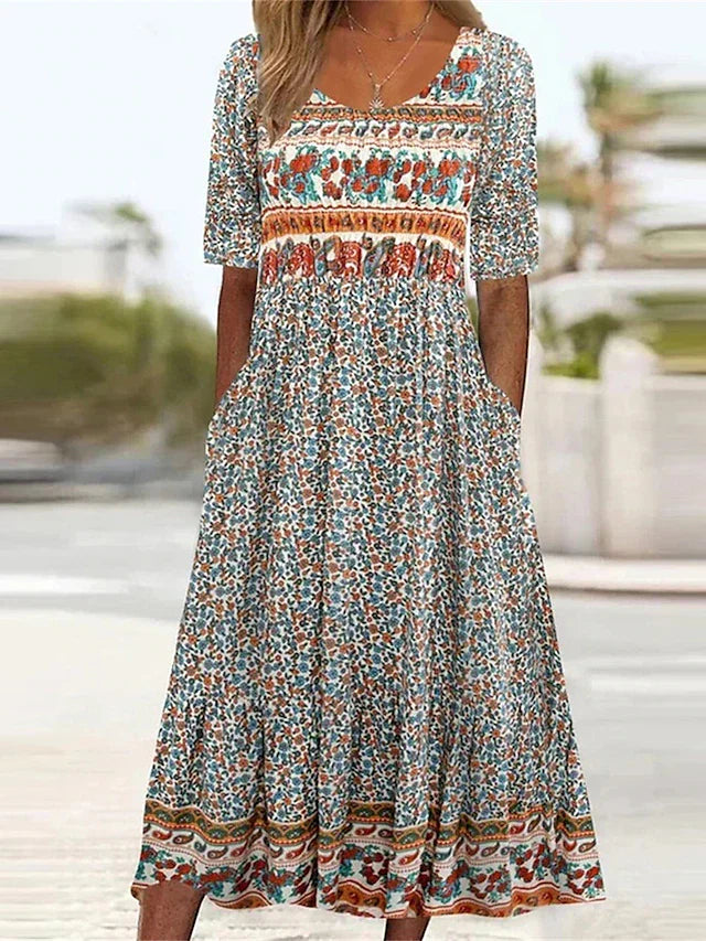 Women's bohemian floral print midi dress with mixed pattern panels — front view