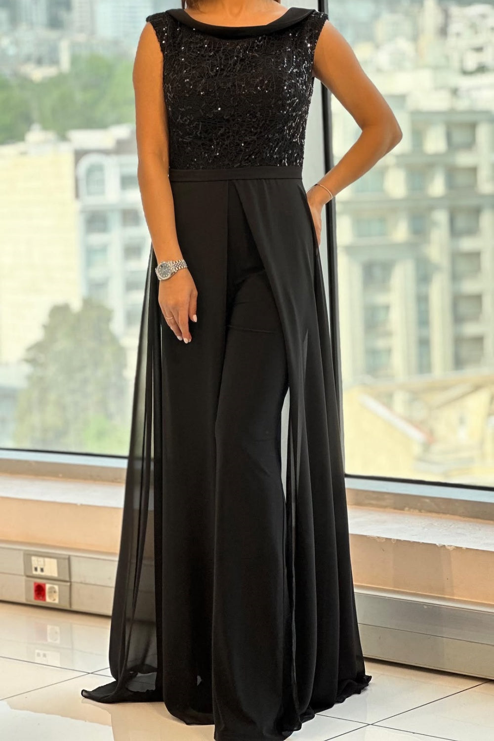Black sequined jumpsuit with wide-leg pants and sleeveless bodice — front view